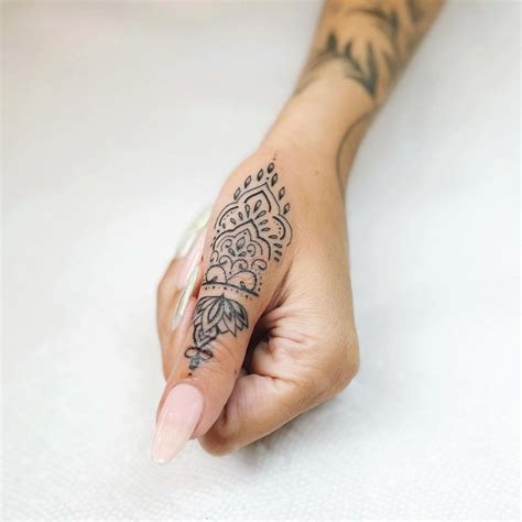 elegant hand tattoos|classy women's unique hand tattoos.